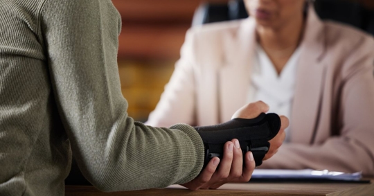 man with injured wrist in personal injury consultation