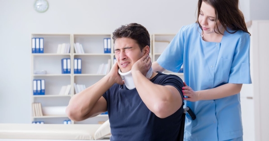 man experiencing neck injury