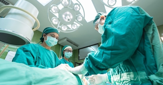 image taken of three medical professionals from low angle
