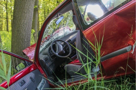 car lying in the ditch on the side of the road