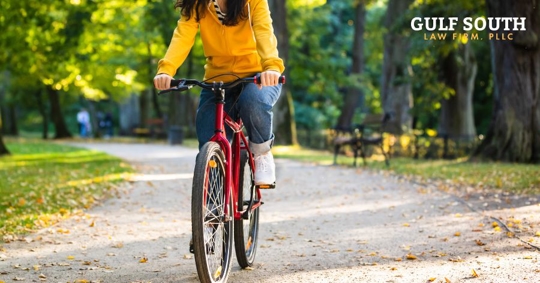 person riding a bike at a park